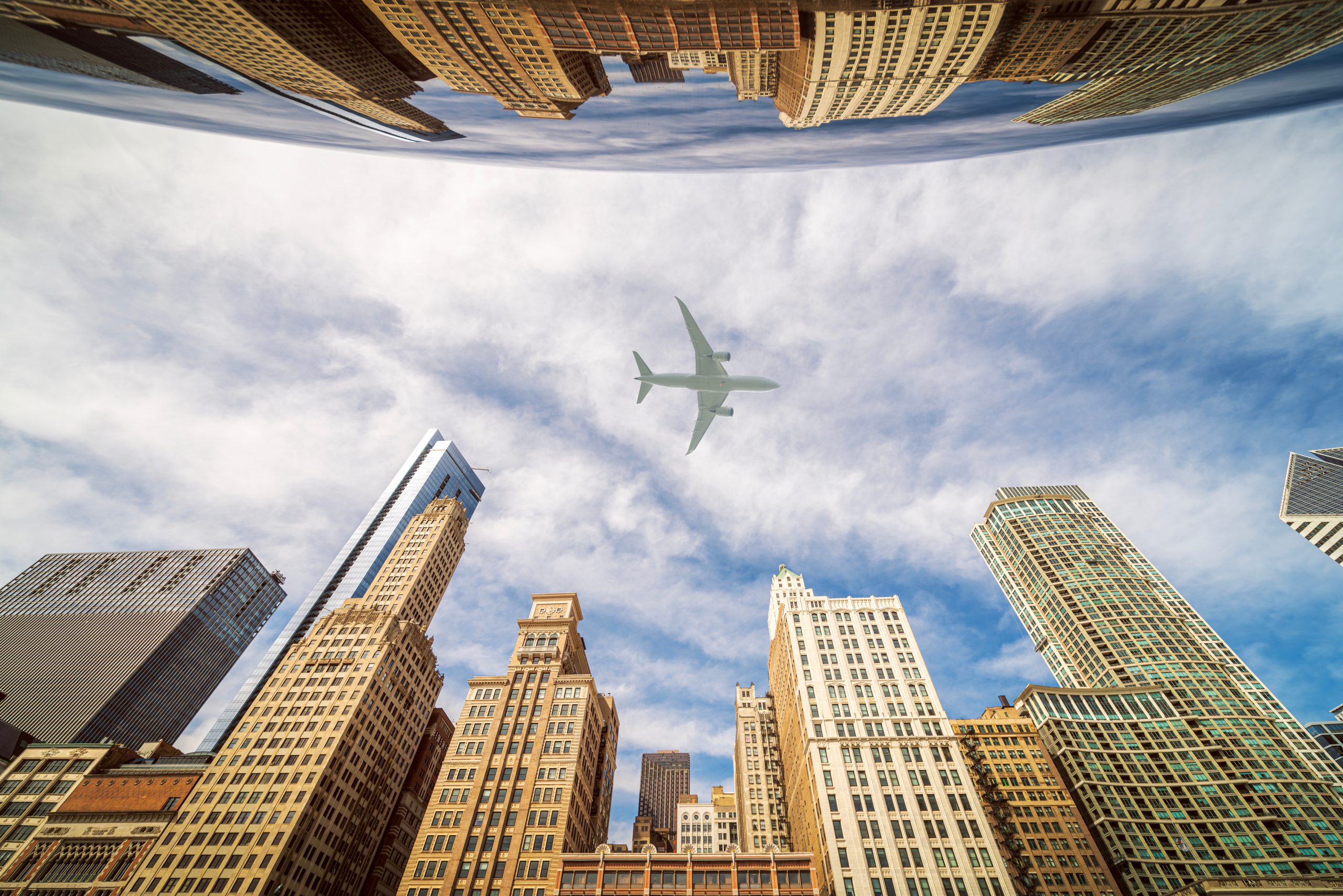 Airplane fly over roof top of building and city of Chicago city, USA